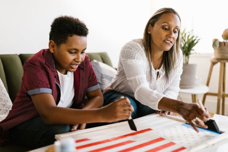 Mother and son enjoy quality time painting a school project at home.