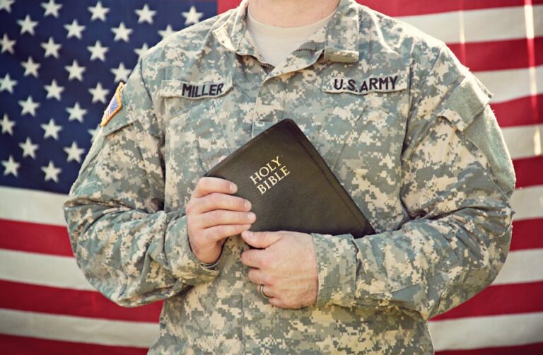 American soldier in uniform holding the Holy Bible, symbolizing faith and patriotism.
